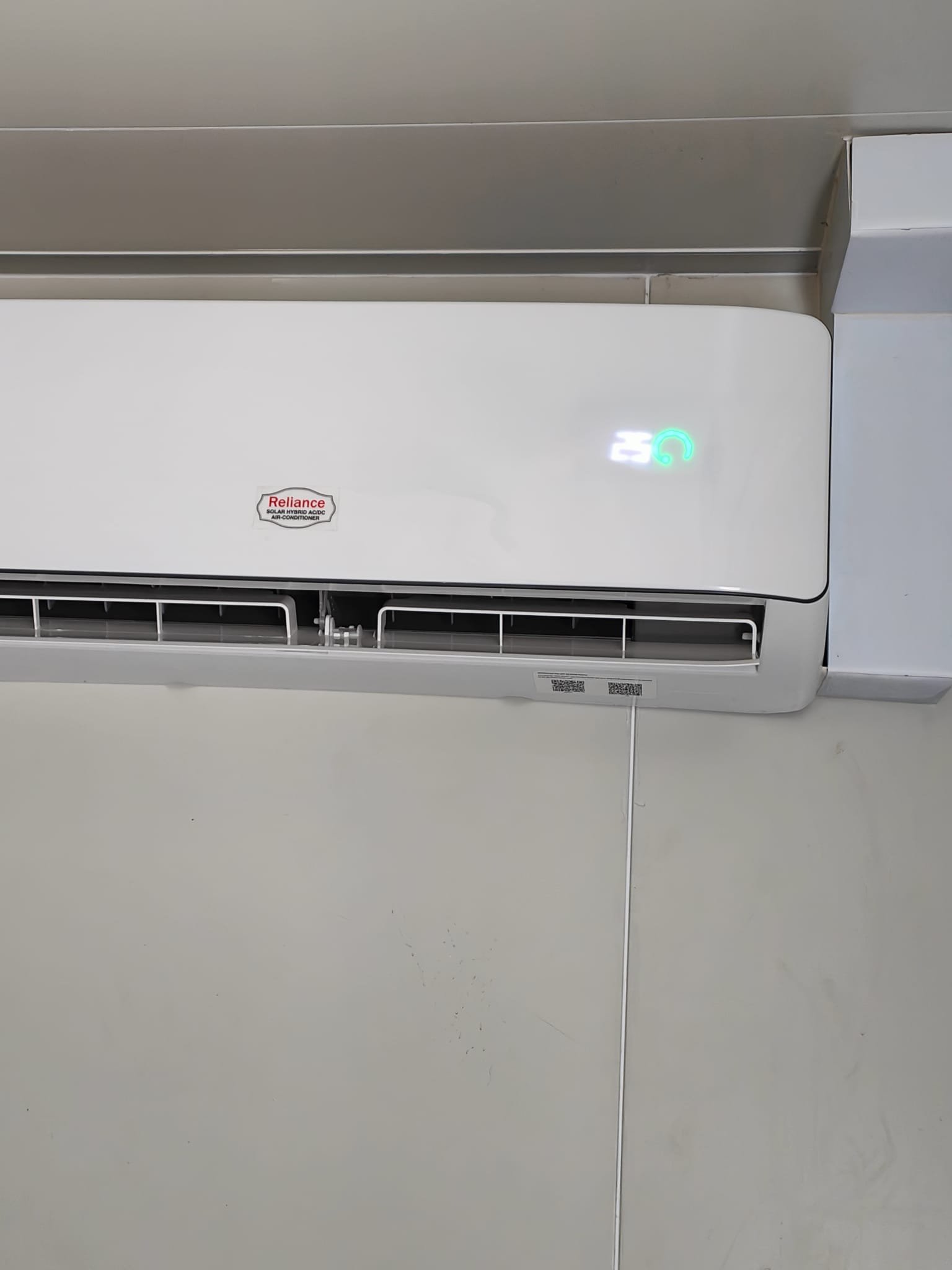 Close-up of the indoor solar air conditioner unit and hydroponic setup